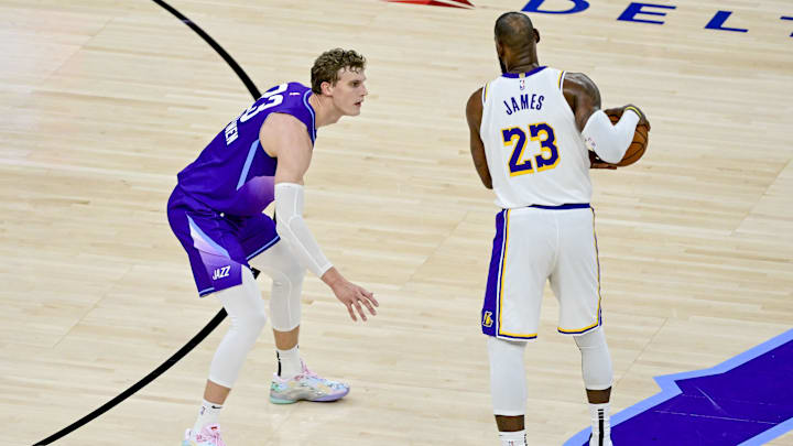 Dec 1, 2024; Salt Lake City, Utah, USA; Utah Jazz forward/center Lauri Markkanen (23) defends Los Angeles Lakers forward LeBron James (23) during the second half at the Delta Center. Mandatory Credit: Christopher Creveling-Imagn Images