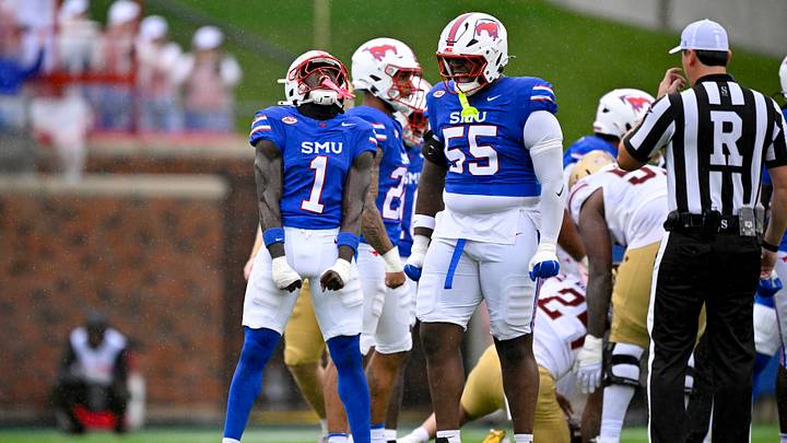 Oct 3, 2026; Dallas, Texas, USA; SMU Mustangs safety Jarvis Lee (1) and defensive lineman Woo Spencer (55) celebrates after making a stop during the first half against the Boston College Eagles at Gerald J. Ford Stadium. Mandatory Credit: Jerome Miron-Imagn Images Oct 3, 2026; Dallas, Texas, USA; SMU Mustangs safety Jarvis Lee (1) and defensive lineman Woo Spencer (55) celebrates after making a stop during the first half against the Boston College Eagles at Gerald J. Ford Stadium. Mandatory Credit: Jerome Miron-Imagn Images