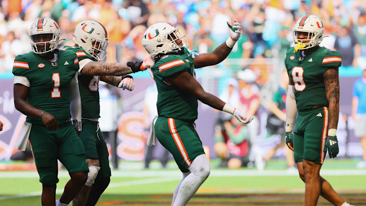 Nov 2, 2024; Miami Gardens, Florida, USA; Miami Hurricanes tight end Elija Lofton (9) celebrates after scoring a touchdown against the Duke Blue Devils during the third quarter at Hard Rock Stadium. Mandatory Credit: Sam Navarro-Imagn Images