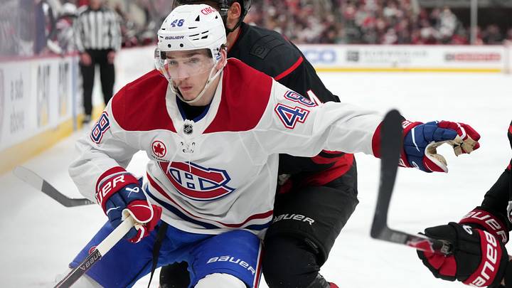 May 29, 2026; Raleigh, North Carolina, USA; Montreal Canadiens defenseman Lane Hutson (48) vies for the position against Carolina Hurricanes center Seth Jarvis (24) in game five of the Eastern Conference Final of the 2026 Stanley Cup Playoffs during the third period at Lenovo Center. Mandatory Credit: James Guillory-Imagn Images
