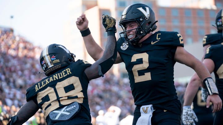 Vanderbilt running back Sedrick Alexander (28) and quarterback Diego Pavia (2) celebrate a touchdown against Alabama in Nashville on Oct. 5, 2024