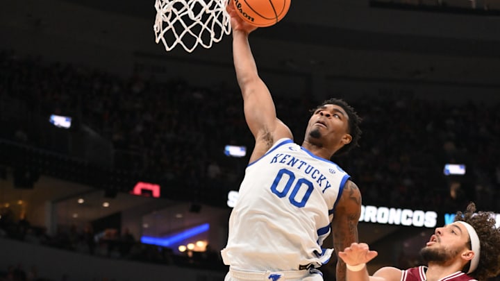 Mar 20, 2026; St. Louis, MO, USA; Kentucky Wildcats guard Otega Oweh (00) leaps to dunk the ball against Santa Clara Broncos forwards Allen Graves (22) and Elijah Mahi (8) during the second half of a first round game of the men's 2026 NCAA Tournament at Enterprise Center. Mandatory Credit: Jeff Curry-Imagn Images Mar 20, 2026; St. Louis, MO, USA; Kentucky Wildcats guard Otega Oweh (00) leaps to dunk the ball against Santa Clara Broncos forwards Allen Graves (22) and Elijah Mahi (8) during the second half of a first round game of the men's 2026 NCAA Tournament at Enterprise Center. Mandatory Credit: Jeff Curry-Imagn Images
