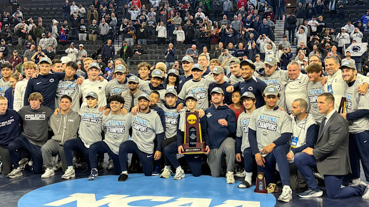 The Penn State wrestling team celebrates winning the team title at the 2025 NCAA Wrestling Championships.
