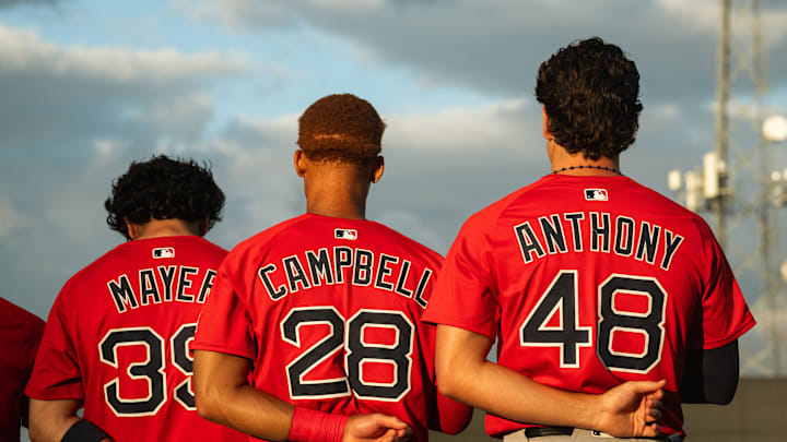 Boston's top-three prospects in Marcelo Mayer, Kristian Campbell and Roman Anthony stand for the national anthem ahead of a Spring Training breakout game on March 13, 2025.