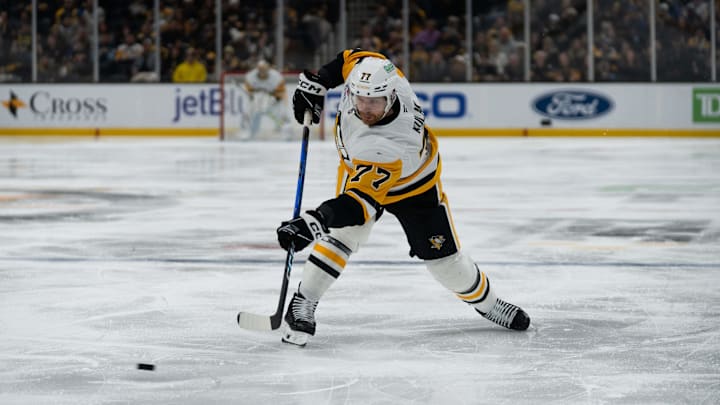 Jan 11, 2026; Boston, Massachusetts, USA; Pittsburgh Penguins defenseman Brett Kulak (77) shoots during the second period of the game against the Boston Bruins at TD Garden. Mandatory Credit: Natalie Reid-Imagn Images