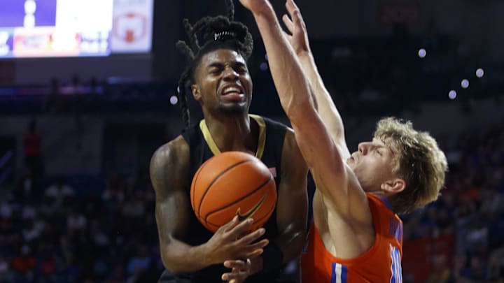 Florida Gators forward Thomas Haugh (10) guards Vanderbilt Commodores guard Jason Edwards (1) during the second half at Exactech Arena at the Stephen C. O'Connell Center.