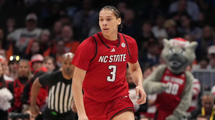 Mar 12, 2026; Charlotte, NC, USA; NC State Wolfpack guard Matt Able (3) brings the ball up the court in the first half at Spectrum Center. Mandatory Credit: Bob Donnan-Imagn Images