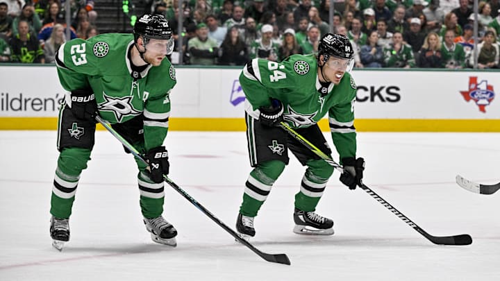 May 29, 2025; Dallas, Texas, USA; Dallas Stars defenseman Esa Lindell (23) and center Mikael Granlund (64) in action during the game between the Dallas Stars and the Edmonton Oilers in game five of the Western Conference Final of the 2025 Stanley Cup Playoffs at American Airlines Center. Mandatory Credit: Jerome Miron-Imagn Images May 29, 2025; Dallas, Texas, USA; Dallas Stars defenseman Esa Lindell (23) and center Mikael Granlund (64) in action during the game between the Dallas Stars and the Edmonton Oilers in game five of the Western Conference Final of the 2025 Stanley Cup Playoffs at American Airlines Center. Mandatory Credit: Jerome Miron-Imagn Images