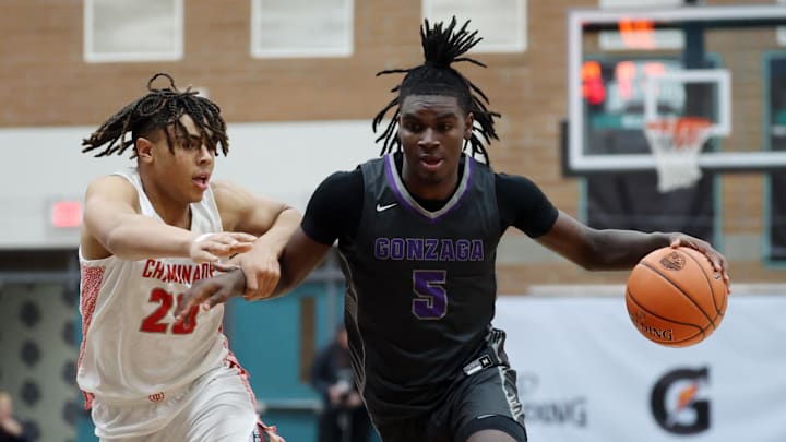 Jan 4, 2025; Gilbert, AZ, USA; Gonzaga (DC) guard Nykolas Lewis (5) against Chaminade (MO) guard Elijah Poniewaz (25) during the Hoophall West High School Invitational at Highland High School. Mandatory Credit: Mark J. Rebilas-Imagn Images