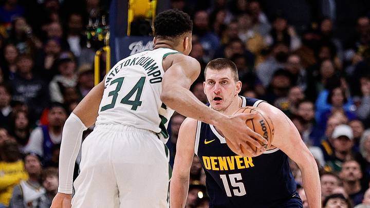 Jan 29, 2024; Denver, Colorado, USA; Milwaukee Bucks forward Giannis Antetokounmpo (34) controls the ball as Denver Nuggets center Nikola Jokic (15) guards in the fourth quarter at Ball Arena. Mandatory Credit: Isaiah J. Downing-USA TODAY Sports Jan 29, 2024; Denver, Colorado, USA; Milwaukee Bucks forward Giannis Antetokounmpo (34) controls the ball as Denver Nuggets center Nikola Jokic (15) guards in the fourth quarter at Ball Arena. Mandatory Credit: Isaiah J. Downing-USA TODAY Sports