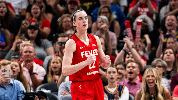 Jul 6, 2024; Indianapolis, Indiana, USA; Indiana Fever guard Caitlin Clark (22) celebrates after scoring against the New York Liberty at Gainbridge Fieldhouse. Mandatory Credit: Grace Smith/INDIANAPOLIS STAR-Imagn Images