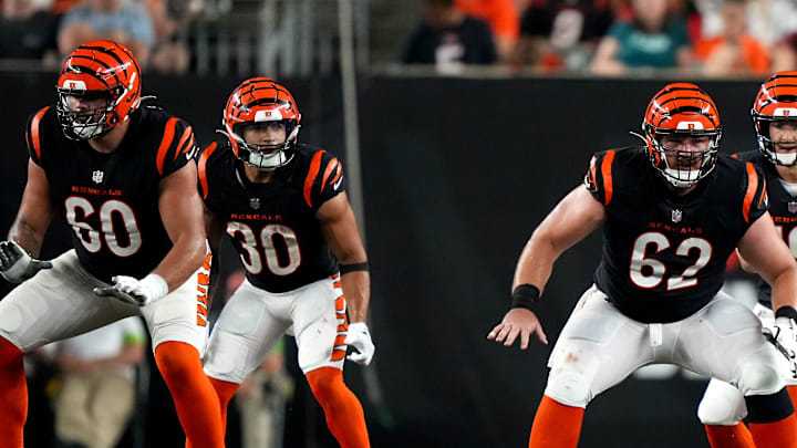 Cincinnati Bengals quarterback Trevor Siemian (19) takes the sap as Cincinnati Bengals guard Jaxson Kirkland (60), Cincinnati Bengals offensive guard Ben Brown (61) and Cincinnati Bengals guard Nate Gilliam (66), right, during a Week 1 NFL preseason game between the Green Bay Packers and the Cincinnati Bengals, Friday, Aug. 11, 2023, at Paycor Stadium in Cincinnati. Cincinnati Bengals quarterback Trevor Siemian (19) takes the sap as Cincinnati Bengals guard Jaxson Kirkland (60), Cincinnati Bengals offensive guard Ben Brown (61) and Cincinnati Bengals guard Nate Gilliam (66), right, during a Week 1 NFL preseason game between the Green Bay Packers and the Cincinnati Bengals, Friday, Aug. 11, 2023, at Paycor Stadium in Cincinnati.