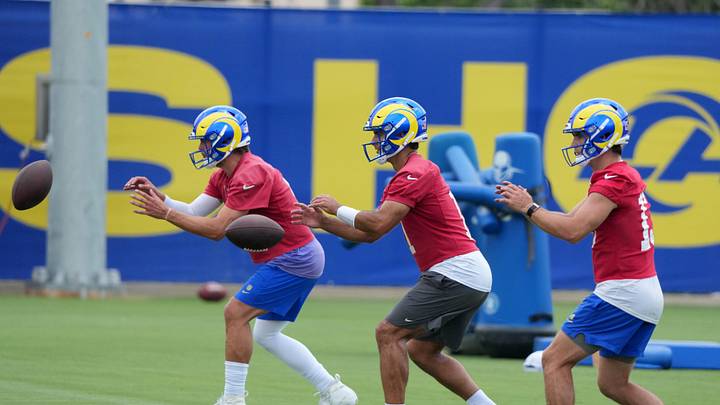Jun 3, 2025; Woodland Hills, CA, USA; Los Angeles Rams quarterbacks Matthew Stafford (left), Jimmy Garoppolo (center) and Stetson Bennett take the snap during organized team activities at Rams Practice Facility. Mandatory Credit: Kirby Lee-Imagn Images