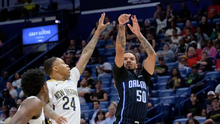 Oct 7, 2024; New Orleans, Louisiana, USA; Orlando Magic guard Cole Anthony (50) shoots against New Orleans Pelicans guard Jordan Hawkins (24) during the first half at Smoothie King Center. Oct 7, 2024; New Orleans, Louisiana, USA; Orlando Magic guard Cole Anthony (50) shoots against New Orleans Pelicans guard Jordan Hawkins (24) during the first half at Smoothie King Center.