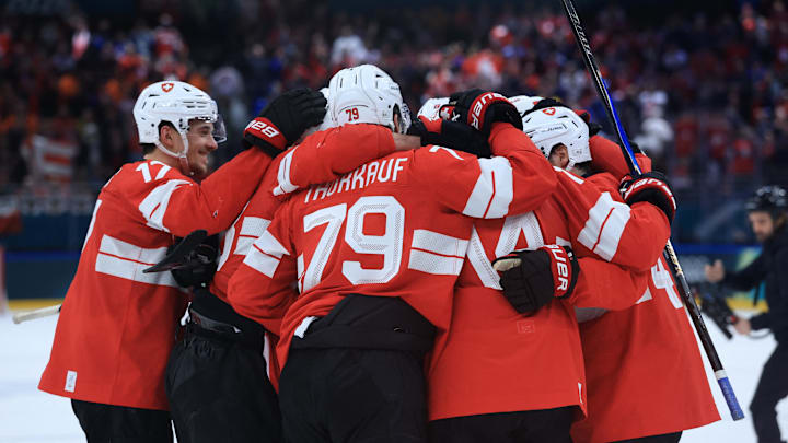 Switzerland is favored against Italy in the Olympic qualification playoff.