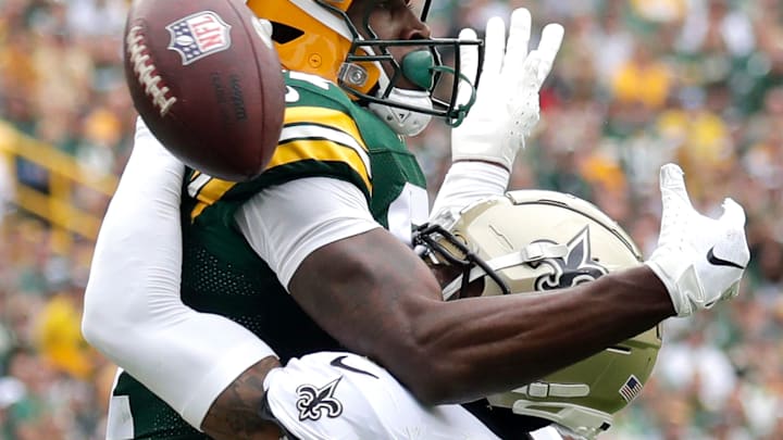 New Orleans Saints cornerback Alontae Taylor (1) breaks up a pass to Green Bay Packers wide receiver Romeo Doubs (87)during their football game Sunday, September 24, 2023, at Lambeau Field in Green Bay, Wis.