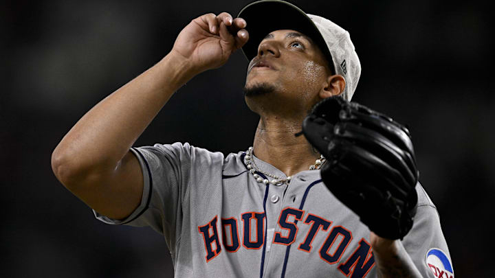 Houston Astros relief pitcher Bryan Abreu (52) comes off the field after he pitches.