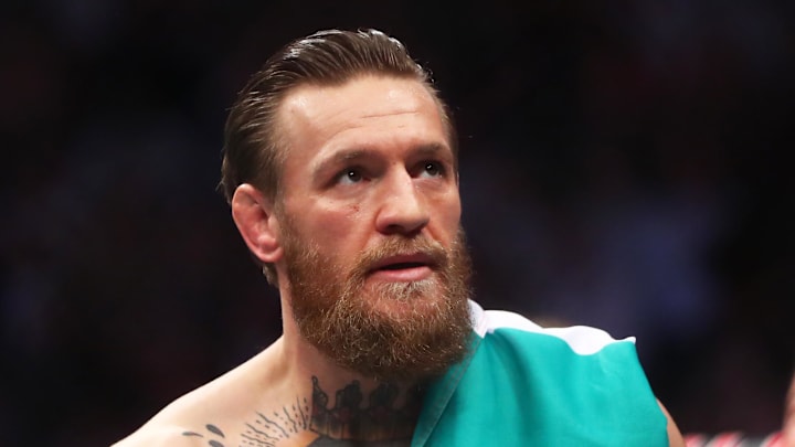 January 18, 2020; Las Vegas, Nevada, USA; Conor McGregor holds an Irish flag as he celebrates his first round TKO victory against Donald Cerrone following UFC 246 at T-Mobile Arena. Mandatory Credit: Mark J. Rebilas-Imagn Images
