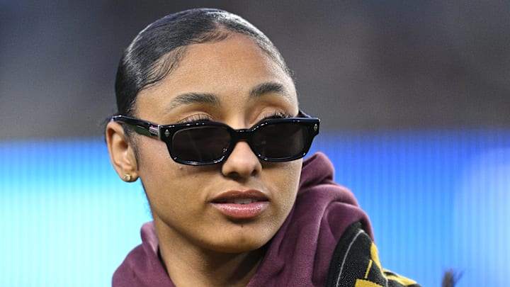 Apr 20, 2024: USC Trojans women's basketball guard JuJu Watkins looks on with the LAFC falcon before the game against the New York Red Bulls.