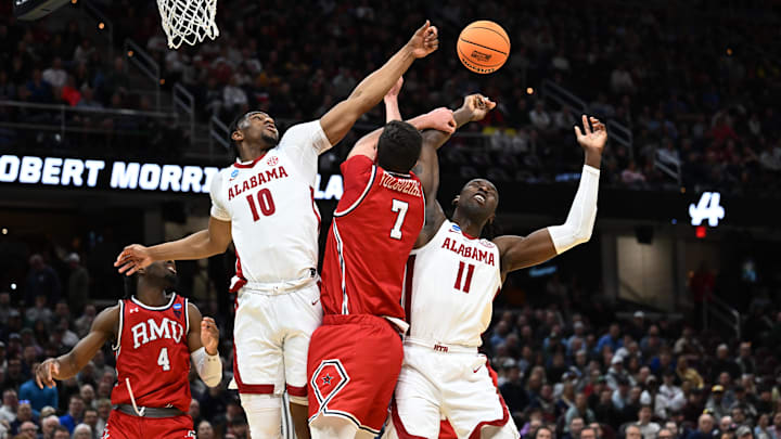Mar 21, 2025; Cleveland, OH, USA; Alabama Crimson Tide forward Mouhamed Dioubate (10) and center Clifford Omoruyi (11) battles Robert Morris Colonials forward Alvaro Folgueiras (7) for a rebound in the first half during the NCAA Tournament First Round at Rocket Arena. Mandatory Credit: Ken Blaze-Imagn Images Mar 21, 2025; Cleveland, OH, USA; Alabama Crimson Tide forward Mouhamed Dioubate (10) and center Clifford Omoruyi (11) battles Robert Morris Colonials forward Alvaro Folgueiras (7) for a rebound in the first half during the NCAA Tournament First Round at Rocket Arena. Mandatory Credit: Ken Blaze-Imagn Images
