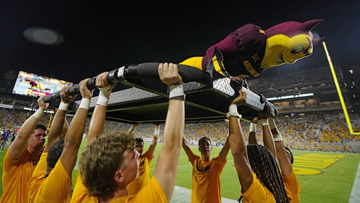 Sparky the Arizona State mascot does pushups after a touchdown against NAU during a game at Mountain America Stadium in Tempe on Aug. 30, 2025. Sparky the Arizona State mascot does pushups after a touchdown against NAU during a game at Mountain America Stadium in Tempe on Aug. 30, 2025.