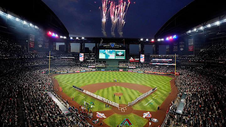 Fireworks go off after the signing of the national anthem during Opening Day game between the Diamondbacks and the Rockies at Chase Field.