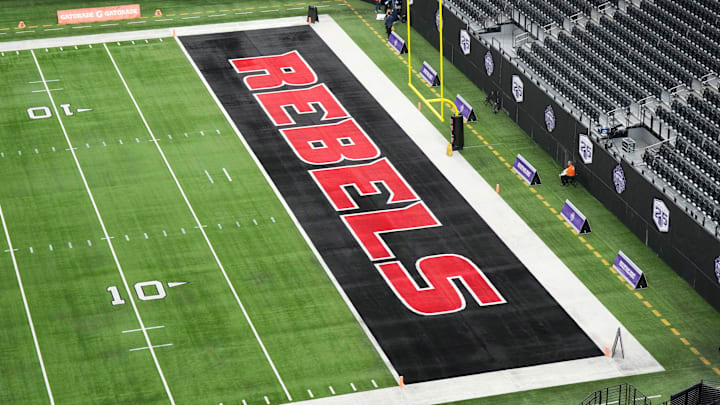 The UNLV Rebels logo in the end zone is seen before the Mountain West Championship between the Boise State Broncos and the UNLV Rebels at Allegiant Stadium. Mandatory Credit: Kirby Lee-Imagn Images The UNLV Rebels logo in the end zone is seen before the Mountain West Championship between the Boise State Broncos and the UNLV Rebels at Allegiant Stadium. Mandatory Credit: Kirby Lee-Imagn Images
