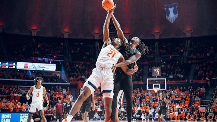 Illinois forward Morez Johnson Jr. (21) battles for a rebound in the Illini's 87-40 win over Maryland Eastern Shore on Saturday at the State Farm Center in Champaign, Illinois.