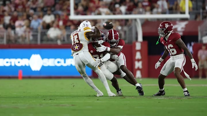 Dre Kirkpatrick Jr. (21) forces a fumble against ULM.