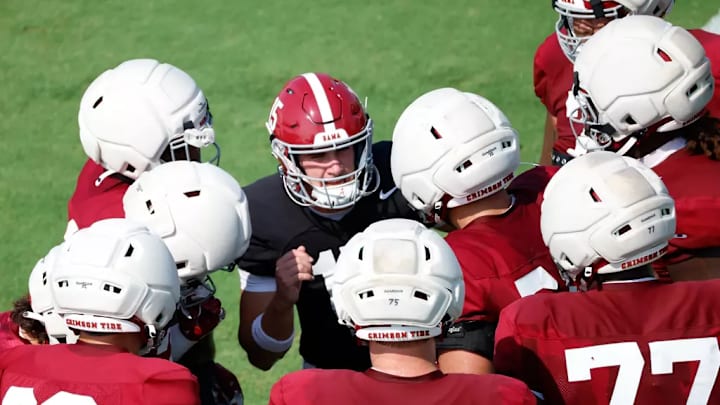 Ty Simpson leads the Alabama huddle at practice