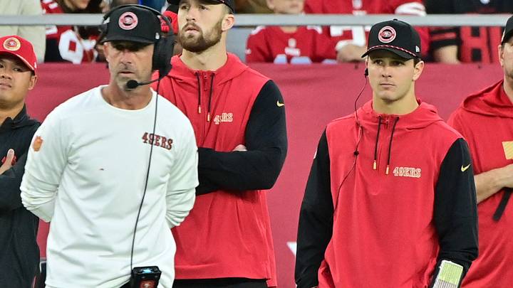 Jan 5, 2025; Glendale, Arizona, USA;  San Francisco 49ers quarterback Brock Purdy (right) and head coach Kyle Shanahan (left) look on the in second half against the Arizona Cardinals at State Farm Stadium. Mandatory Credit: Matt Kartozian-Imagn Images