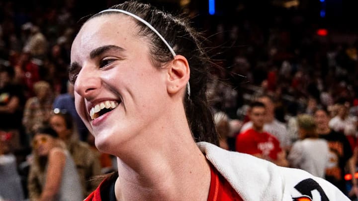 Indiana Fever guard Caitlin Clark smiles in an interview after becoming the first rookie to achieve a triple-double.