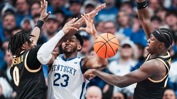 Kentucky Wildcats forward Mouhamed Dioubate (23) gets double-teamed by Missouri Tigers guard Anthony Robinson II (0) at left and Missouri Tigers forward Mark Mitchell (25) in the second half as Kentucky fell to the Tigers 73-68 during SEC college basketball Wednesday night at Rupp Arena in Lexington, Kentucky January 7, 2026.