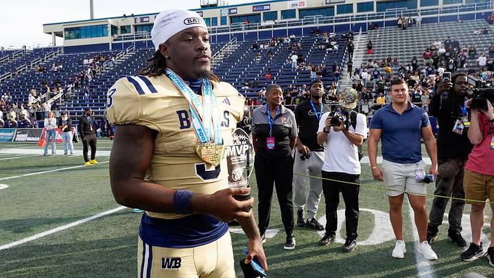 West Boca running back Javian Mallory (3) poses with the MVP trophy after a 31-0 victory over West Broward in the 6A State Final at Pitbull Stadium on Dec. 12, 2025, in Miami, FL.