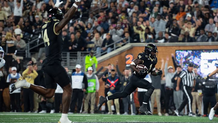 Wake Forest running back Demond Claiborne races towards the endzone in the game against North Carolina. Wake Forest running back Demond Claiborne races towards the endzone in the game against North Carolina.