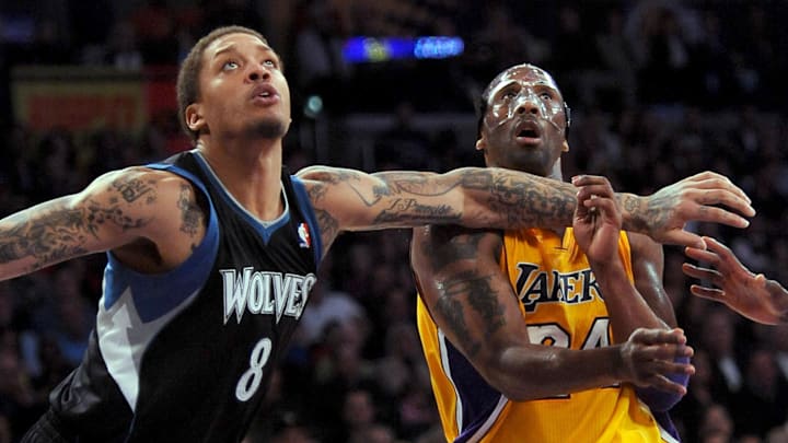 Feb. 29, 2012; Los Angeles, CA, USA;  Minnesota Timberwolves small forward Michael Beasley (8) and Los Angeles Lakers shooting guard Kobe Bryant (24) fight for position under the basket in the second half of the game at the Staples Center.  Lakers won 104-85. Mandatory Credit: Jayne Kamin-Oncea-Imagn Images