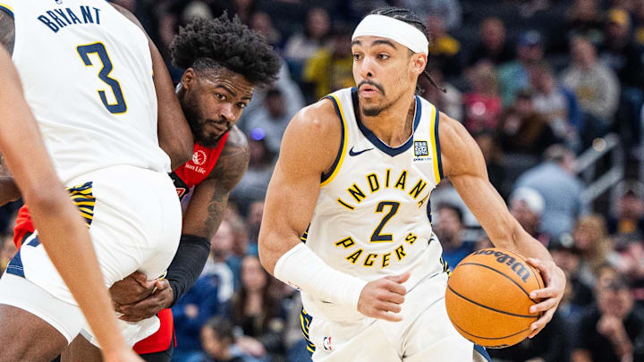 Feb 26, 2025; Indianapolis, Indiana, USA; Indiana Pacers guard Andrew Nembhard (2) dribbles the ball in the second half against the Toronto Raptors at Gainbridge Fieldhouse. Mandatory Credit: Trevor Ruszkowski-Imagn Images