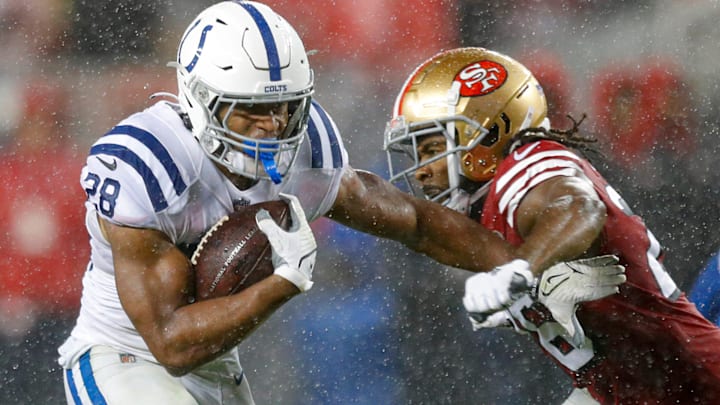 Indianapolis Colts running back Jonathan Taylor (28) fends off San Francisco 49ers cornerback Josh Norman (26)  during the first half of the game Sunday, Oct. 24, 2021, at Levi's Stadium in Santa Clara, Calif.

Indianapolis Colts Visit The San Francisco 49ers For Nfl Week 7 At Levi S Stadium In Santa Clara Calif Sunday Oct 24 2021