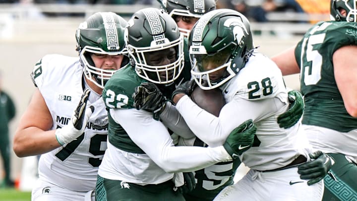 Michigan State's Bai Jobe, left, tackles Brandon Tullis during the Spring Showcase on Saturday, April 20, 2024, at Spartan Stadium in East Lansing.