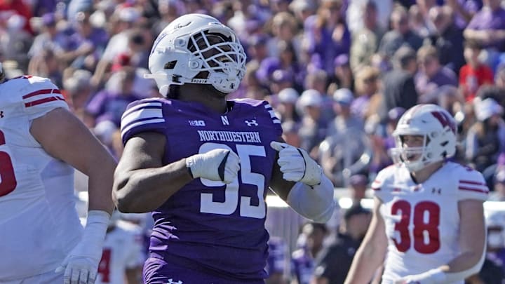 Oct 19, 2024; Evanston, Illinois, USA; Northwestern Wildcats defensive lineman Najee Story (95) sacks Wisconsin Badgers quarterback Braedyn Locke (not pictured) during the first half at Lanny and Sharon Martin Stadium. Mandatory Credit: David Banks-Imagn Images