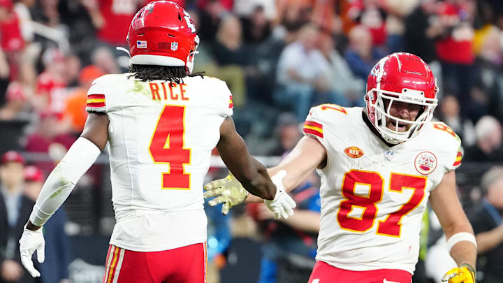 Nov 26, 2023; Paradise, Nevada, USA; Kansas City Chiefs wide receiver Rashee Rice (4) celebrates with Kansas City Chiefs tight end Travis Kelce (87) after scoring a touchdown against the Las Vegas Raiders during the fourth quarter at Allegiant Stadium. Mandatory Credit: Stephen R. Sylvanie-Imagn Images