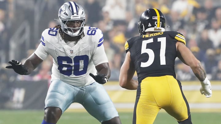 Dallas Cowboys offensive tackle Tyler Guyton blocks at the line of scrimmage against Pittsburgh Steelers linebacker Nick Herbig during the first quarter at Acrisure Stadium. Dallas Cowboys offensive tackle Tyler Guyton blocks at the line of scrimmage against Pittsburgh Steelers linebacker Nick Herbig during the first quarter at Acrisure Stadium.