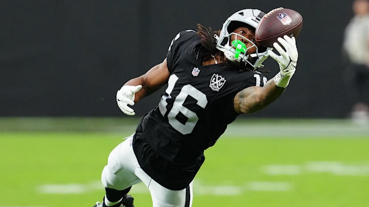 Sep 29, 2024; Paradise, Nevada, USA; Las Vegas Raiders wide receiver Jakobi Meyers (16) attempts to make a catch against the Cleveland Browns during the third quarter at Allegiant Stadium. Mandatory Credit: Stephen R. Sylvanie-Imagn Images