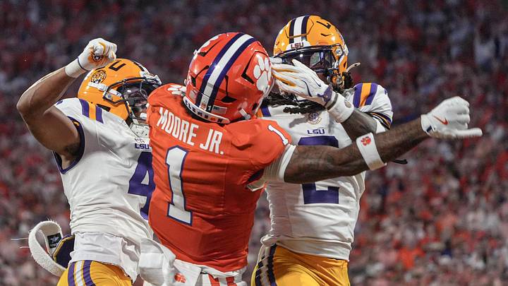 Louisiana State University cornerback Mansoor Delane (4) and Louisiana State University safety Jardin Gilbert (2) break up a pass for Clemson’s TJ Moore Jr. (1) during the first quarter at Memorial Stadium in Clemson, S.C. Saturday, August 30, 2025.