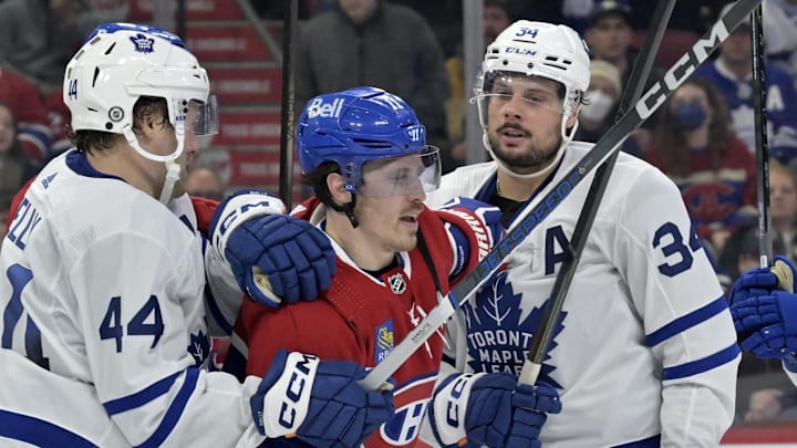 Mar 9, 2024; Montreal, Quebec, CAN; Toronto Maple Leafs defenseman Morgan Rielly (44) and teammate Toronto Maple Leafs forward Auston Matthews (34) escort Montreal Canadiens forward Brendan Gallagher (11) away from their net during the second period at the Bell Centre. Mandatory Credit: Eric Bolte-Imagn Images