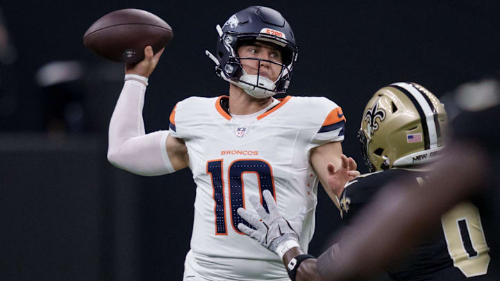 Aug 23, 2025; New Orleans, Louisiana, USA;  Denver Broncos quarterback Bo Nix (10) throws against New Orleans Saints safety Ugo Amadi (0) during the first half at Caesars Superdome. 