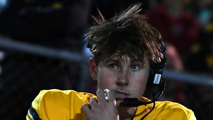 Moeller quarterback Matt Ponatoski, recently named Ohio Mr. Football and Gatorade Football Player of the Year, can often be seen wearing a headset as he is in the regional semifinal game with Princeton Nov. 15, 2024.