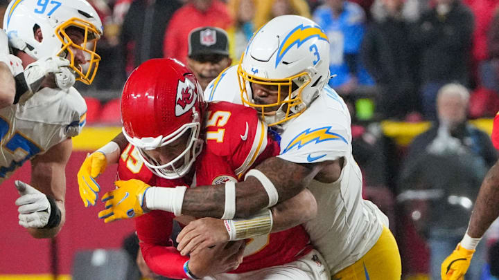 Dec 8, 2024; Kansas City, Missouri, USA; Kansas City Chiefs quarterback Patrick Mahomes (15) is sacked by Los Angeles Chargers safety Derwin James Jr. (3) during the first half at GEHA Field at Arrowhead Stadium. Mandatory Credit: Denny Medley-Imagn Images