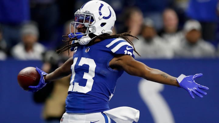 Indianapolis Colts wide receiver T.Y. Hilton (13) celebrates after catching the ball for a touchdown after it's juggled by Indianapolis Colts wide receiver Ashton Dulin (16), Las Vegas Raiders free safety Tre'von Moehrig (25) and Las Vegas Raiders cornerback Casey Hayward Jr. (29) on Sunday, Jan. 2, 2022, during a game against the Las Vegas Raiders at Lucas Oil Stadium in Indianapolis.