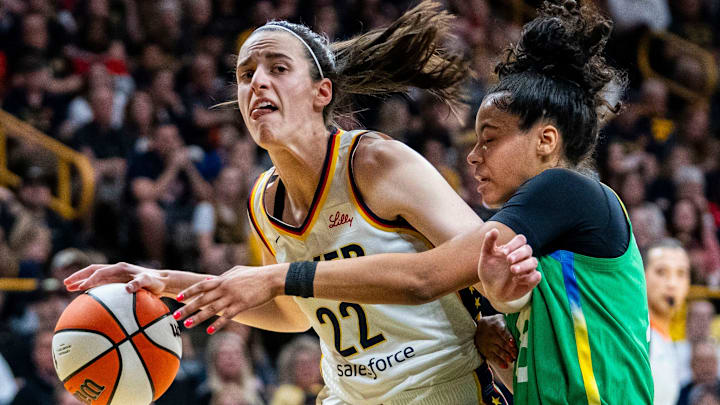 Indiana Fever guard Caitlin Clark (22) takes the ball to the basket against Brazilian National Team guard Tainá Mayor da Paixão (8) on Sunday, May 4, 2025, during a preseason game between the Indiana Fever and the Brazil national team at Carver-Hawkeye Arena in Iowa City.